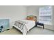 Cozy bedroom featuring a bed with colorful accents and natural light from the window at 1652 Camfield Ln, Mount Pleasant, SC 29466