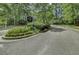 A welcoming entrance to Ellington Woods featuring lush landscaping and an elegant community sign at 1652 Camfield Ln, Mount Pleasant, SC 29466