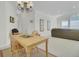 The dining area features light wood furniture and natural light, flowing into the living room at 1652 Camfield Ln, Mount Pleasant, SC 29466