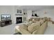 Bright living room with fireplace, comfortable seating, and view into kitchen at 1652 Camfield Ln, Mount Pleasant, SC 29466