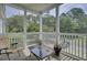 Screened porch with outdoor seating overlooking lush greenery at 1652 Camfield Ln, Mount Pleasant, SC 29466