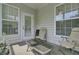 Private outdoor porch with comfortable seating and natural light at 1652 Camfield Ln, Mount Pleasant, SC 29466