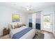 Cozy bedroom with accent wall, plush bedding, large windows, and ceiling fan at 1712 Chatelain Way, Mount Pleasant, SC 29464
