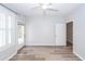 A bright and airy bedroom with wood-look floors, a ceiling fan, and ample natural light at 1712 Chatelain Way, Mount Pleasant, SC 29464