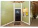 Apartment entrance with dark door, emergency box, green siding, and welcome mat at 1712 Chatelain Way, Mount Pleasant, SC 29464