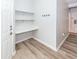 Entryway featuring a built-in desk with shelving and a coat hook rack at 1712 Chatelain Way, Mount Pleasant, SC 29464
