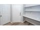 Entryway featuring a built-in desk with shelving and a white front door at 1712 Chatelain Way, Mount Pleasant, SC 29464