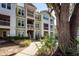 Condominium exterior with green siding, white trim, balconies, and mature landscaping at 1712 Chatelain Way, Mount Pleasant, SC 29464