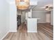 An open-concept kitchen and living area with white cabinets and stainless steel appliances at 1712 Chatelain Way, Mount Pleasant, SC 29464