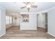 Open-concept living space with wood floors, ceiling fan, and view of the kitchen at 1712 Chatelain Way, Mount Pleasant, SC 29464