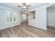 Open-concept living area with lots of light, wood flooring, and neutral paint at 1712 Chatelain Way, Mount Pleasant, SC 29464