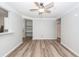 Open-concept living space with wood floors, ceiling fan, and built in storage at 1712 Chatelain Way, Mount Pleasant, SC 29464