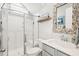Modern bathroom with a glass-enclosed shower, stylish vanity, and decorative mirror, offering a spa-like experience at 1714 Banning St, Mount Pleasant, SC 29466