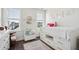 Bright bedroom features twin bed with storage and two windows that allow natural light at 1714 Banning St, Mount Pleasant, SC 29466