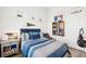 Comfortable bedroom with baseball decor, soft blue bedding, and natural light, perfect for a sports enthusiast at 1714 Banning St, Mount Pleasant, SC 29466