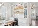 Elegant dining area with built-in cabinetry, open shelving, and a stylish wine cooler at 1714 Banning St, Mount Pleasant, SC 29466