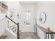 Bright entryway with a staircase, console table, and stylish decor, creating a welcoming first impression at 1714 Banning St, Mount Pleasant, SC 29466
