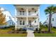 Charming two-story white home featuring double porches, manicured landscaping, and a welcoming entrance at 1714 Banning St, Mount Pleasant, SC 29466
