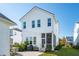 Beautiful back of house with screened in porch, beautiful landscaping and patio at 1714 Banning St, Mount Pleasant, SC 29466