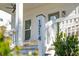 Close-up of the house number on a white porch column with a view of outdoor seating at 1714 Banning St, Mount Pleasant, SC 29466