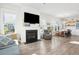 Open-concept living space with a fireplace, comfortable seating, and a view of the dining area at 1714 Banning St, Mount Pleasant, SC 29466