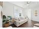 Bright living room featuring hardwood floors, a couch, and natural light at 1714 Banning St, Mount Pleasant, SC 29466