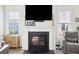 Cozy living room featuring a fireplace with a TV mounted above, creating a relaxing ambiance at 1714 Banning St, Mount Pleasant, SC 29466