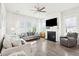 Bright and airy living room with a fireplace, comfortable seating, and large windows for natural light at 1714 Banning St, Mount Pleasant, SC 29466