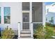 Charming porch with screened door, white railings and beautiful landscaping at 1714 Banning St, Mount Pleasant, SC 29466