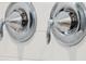 Close up on MOEN shower handles over white tiled shower wall at 1714 Banning St, Mount Pleasant, SC 29466