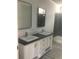 Bathroom with dual vanities, modern fixtures, and glass-enclosed shower showcasing contemporary design at 183 Waverly Rd, Walterboro, SC 29488