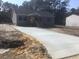 Charming single-story home with gray siding, black shutters, and a new concrete driveway at 183 Waverly Rd, Walterboro, SC 29488