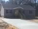 A lovely single-story home with a covered porch and a newly poured concrete driveway at 183 Waverly Rd, Walterboro, SC 29488