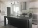 Gourmet kitchen featuring stainless steel appliances, granite countertops and a large center island at 183 Waverly Rd, Walterboro, SC 29488