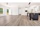 Spacious living room with wood-look flooring and a modern kitchen island at 183 Waverly Rd, Walterboro, SC 29488