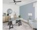 Modern home office features a ceiling fan, shiplap accent wall, and lots of natural light at 2094 Cousteau Ct, Johns Island, SC 29455