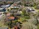 An aerial view of a home with mature trees, lush greenery, and a glimpse of the surrounding neighborhood at 222 E Main St, Moncks Corner, SC 29461