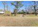 Large backyard perfect for outdoor activities and gatherings with fire pit at 222 E Main St, Moncks Corner, SC 29461
