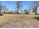 Spacious backyard with mature trees, providing ample space for outdoor activities and expansion at 222 E Main St, Moncks Corner, SC 29461
