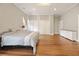 Spacious bedroom with hardwood floors, large closet doors, and ample natural light at 222 E Main St, Moncks Corner, SC 29461