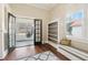 Cozy room with hardwood floors, built-in shelves, and a hammock on the sunroom provides a versatile and inviting retreat at 222 E Main St, Moncks Corner, SC 29461