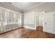 Bedroom featuring hardwood floors, large windows, and light gray walls at 222 E Main St, Moncks Corner, SC 29461