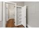 Hallway with hardwood floors and built-in storage at 222 E Main St, Moncks Corner, SC 29461