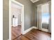 Hallway with wood floors and view of adjacent spaces, and a mini fridge provides practicality and style at 222 E Main St, Moncks Corner, SC 29461