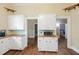 Charming kitchen with white cabinets, butcher block countertops, and vintage-inspired details at 222 E Main St, Moncks Corner, SC 29461