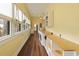 Long laundry room with washer, dryer, storage, countertop, and hanging plants at 222 E Main St, Moncks Corner, SC 29461