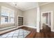 Bright living room with hardwood floors, built-in shelving, and neutral decor offers a comfortable and versatile space at 222 E Main St, Moncks Corner, SC 29461