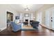 Bright living room featuring hardwood floors, fireplace, and stylish furnishings at 222 E Main St, Moncks Corner, SC 29461