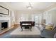 Cozy living room featuring hardwood floors, fireplace, and stylish furnishings at 222 E Main St, Moncks Corner, SC 29461
