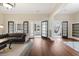 Open living room with hardwood floors, open doorways, and stylish furnishings at 222 E Main St, Moncks Corner, SC 29461